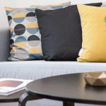 Home Staging - Centerpiece on Coffee Table Beside Sofa With Three Pillows