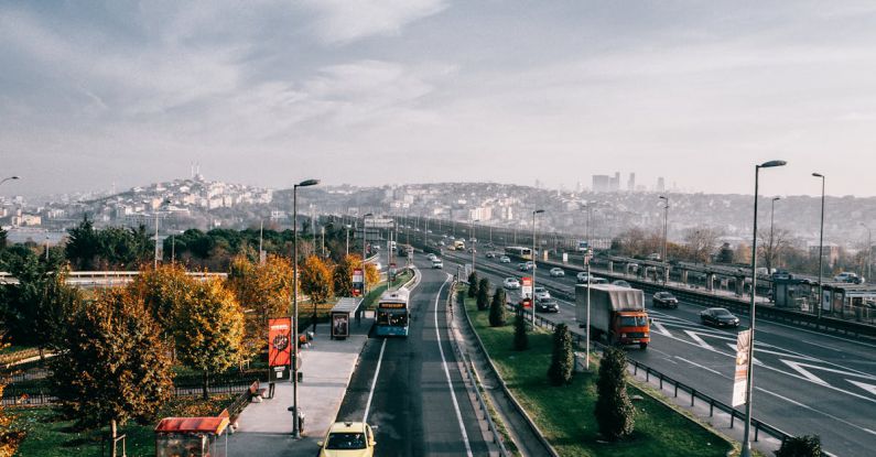 Multiple Offers - Multiple lane highway with driving vehicles located in Istanbul city suburb area on autumn day