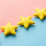 Reviews Ratings - Five Yellow Stars on Blue and Pink Background