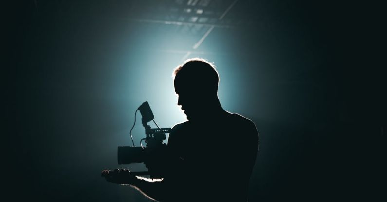 Photography Videography - Silhouette of Man Standing in Front of Microphone