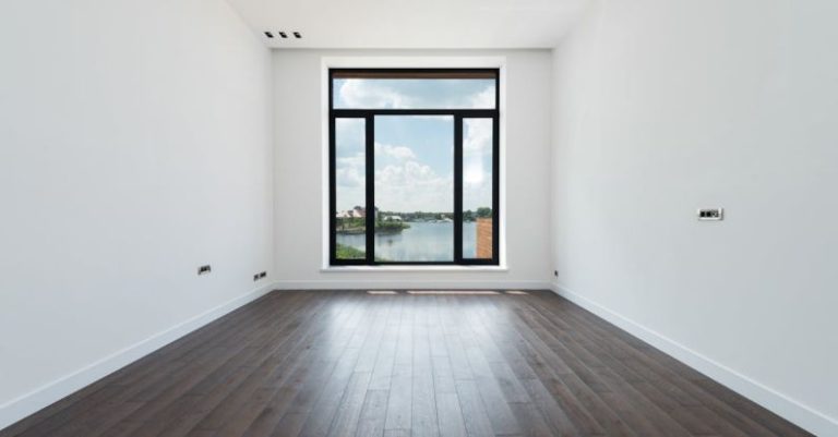 Co-living Space - Interior of modern spacious light room with wooden laminate floor white walls and panoramic windows